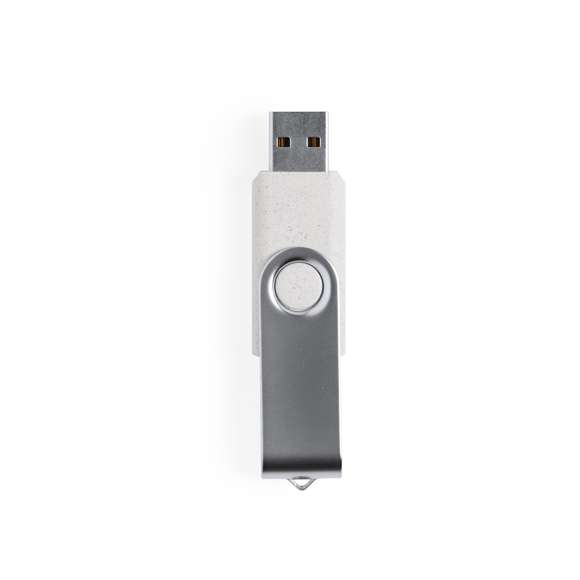 Memoria USB de 16GB de capacidad en línea nature. Cuerpo en caña de trigo, para así fomentar la utilización de materias primas naturales y reducir las emisiones contaminantes y clip metálico de mecanismo giratorio. Presentada en estuche individual de diseño eco.