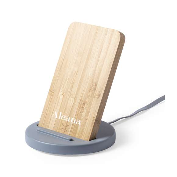 Cargador inalámbrico con función soporte para smartphone. Fabricado en combinación de piezas de bambú de corte nature y cemento de piedra caliza, un conglomerante formado por la mezcla de materiales naturales, principalmente piedra caliza molida y agua, obteniendo un material de gran consistencia y durabilidad.  Indicador led, cable de carga USB a juego y compatible con dispositivos equipados con tecnología de carga inalámbrica. Protección de seguridad para evitar sobrecalentamiento, sobrecarga y cortocircuito. Presentado en atractiva caja de diseño.
