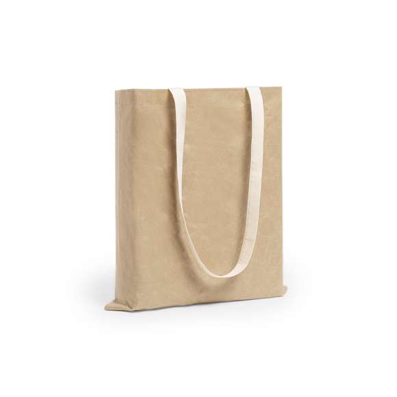 Bolsa de línea nature en resistente papel laminado de 105g/m2, altamente resistente. Asas de algodón largas en color natural. De acabado cosido y resistencia hasta 8kg de peso.