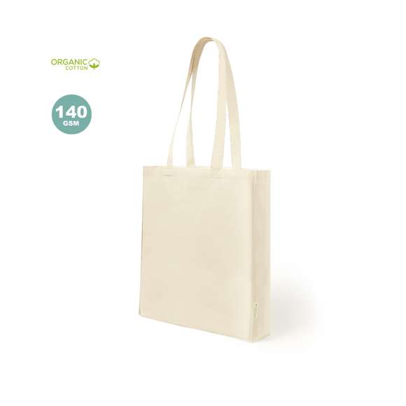 Bolsa de línea nature en algodón orgánico de 140g/m2. Asas largas en algodón orgánico, de 70 cm y reforzadas. Acabado cosido y resistencia de hasta 8kg de peso, con distintivo algodón orgánico en la etiqueta.