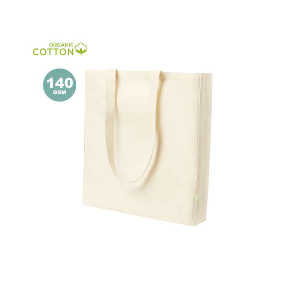 Bolsa de línea nature en algodón orgánico de 140g/m2. Asas largas en algodón orgánico, de 70 cm y reforzadas. Acabado cosido y resistencia de hasta 8kg de peso, con distintivo algodón orgánico en la etiqueta.