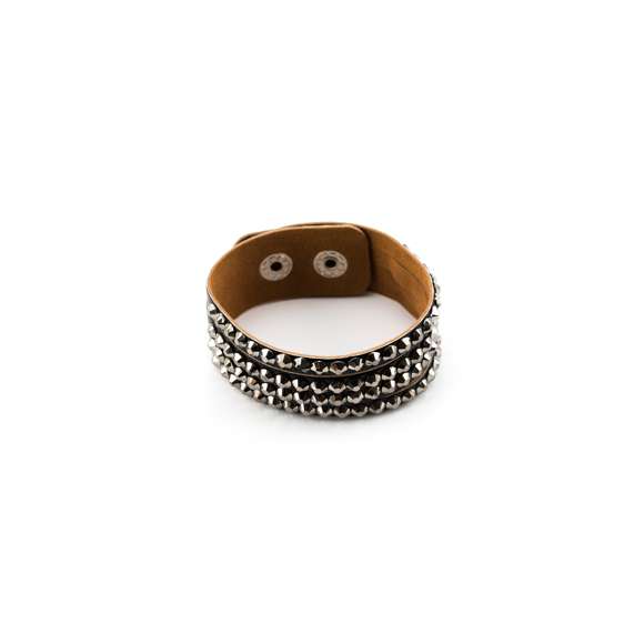 Elegante pulsera de polipiel con incrustaciones brillantea de vivos colores. Con cierre de corchete ajustable.