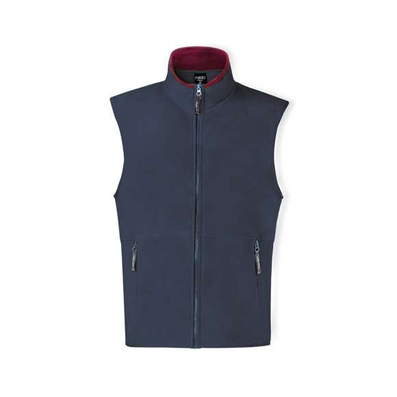 Chaleco en cálido y suave polar fleece de 280g/m2 con tratamiento anti-pilling. Con cuello de interior en color, cierre de cremallera con cinta en tirador, bolsillos laterales de cremallera y cintura elástica. Disponible en tallas M, L, XL, XXL.