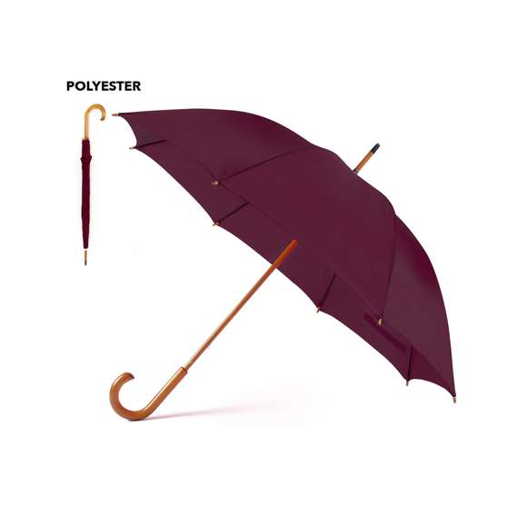 Paraguas de 8 paneles confeccionado en poliéster. De 105cm de diámetro, con apertura manual, varillas metálicas en color negro y cierre de velcro. Palo y mango fabricados en suave madera de color natural, con tela en variada gama de vivos colores.