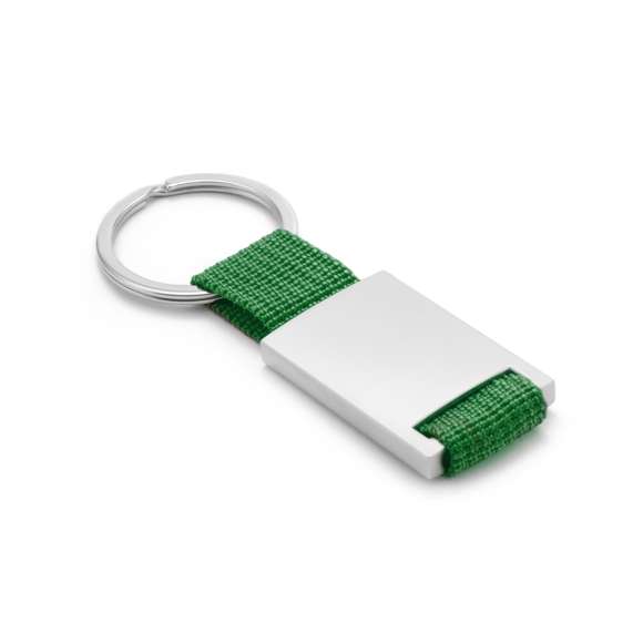 Llavero de divertido diseño con cinta de poliéster de variados y vivos colores. Con cuerpo metálico especialmente diseñado para marcaje en láser.